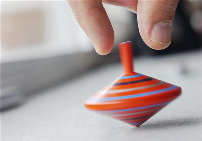 spinning top with hand